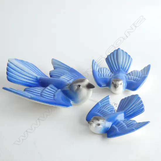 A graduated set of three Poole bluebirds.
